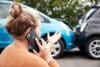 Female Motorist Involved In Car Accident Calling Insurance Company Or Recovery Service